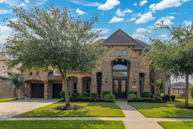 11702 Saporito Way, Richmond, TX 77406 - french country home with french doors, brick siding, driveway, and an attached garage