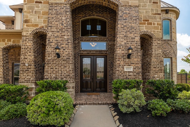 11702 Saporito Way, Richmond, TX 77406 - view of exterior entry featuring french doors and brick siding