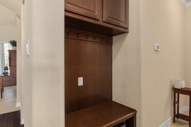 11702 Saporito Way, Richmond, TX 77406 - mudroom featuring baseboards, arched walkways, and wood finished floors