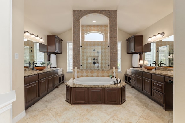 11702 Saporito Way, Richmond, TX 77406 - full bath featuring vaulted ceiling, two vanities, a bath, tiled shower, and tile patterned flooring