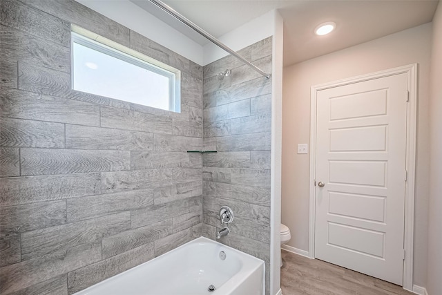 230 Emerald Thicket Ln, Huffman, TX 77336 - bathroom featuring toilet, tub / shower combination, and wood finished floors