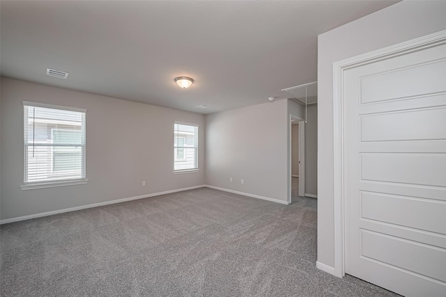230 Emerald Thicket Ln, Huffman, TX 77336 - unfurnished bedroom with attic access, carpet flooring, and baseboards