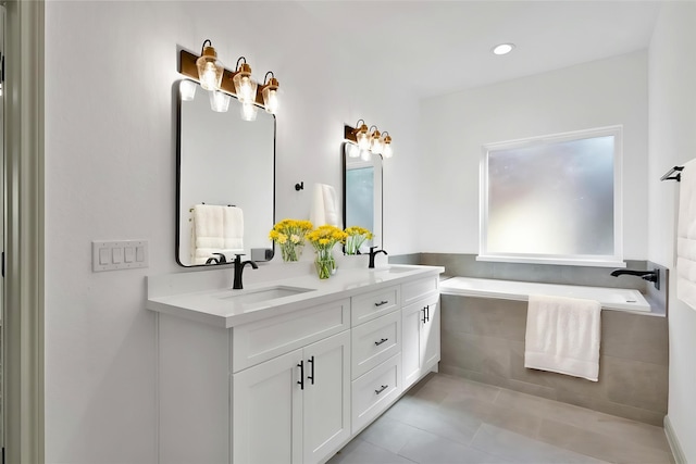 4 Hanover Ln, Panorama Village, TX 77304 - bathroom featuring tile patterned flooring, a bath, double vanity, and recessed lighting