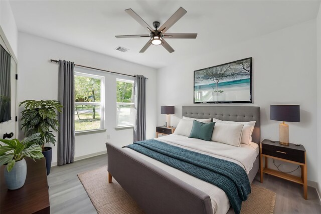 4 Hanover Ln, Panorama Village, TX 77304 - bedroom featuring light wood-style flooring, baseboards, and ceiling fan
