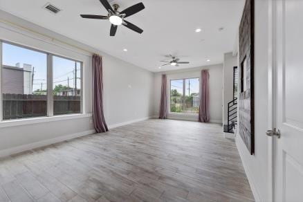 1804 Schweikhardt St, Houston, TX 77020 - empty room with wood finished floors, baseboards, a ceiling fan, and recessed lighting