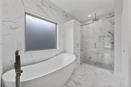 1804 Schweikhardt St, Houston, TX 77020 - bathroom with marble finish floors, a marble finish shower, a freestanding bath, and recessed lighting