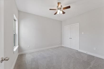1804 Schweikhardt St, Houston, TX 77020 - unfurnished bedroom with carpet floors, baseboards, a closet, and ceiling fan