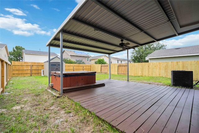 19826 Creston Cove Ct, Cypress, TX 77433 - deck with central AC, a hot tub, and a ceiling fan