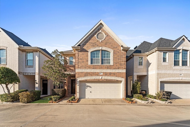 10106 Holly Chase Dr, Houston, TX 77042 - view of front facade featuring brick siding, driveway, and a garage