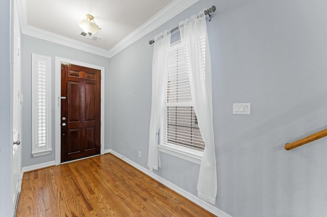 10106 Holly Chase Dr, Houston, TX 77042 - entrance foyer with wood finished floors, baseboards, and crown molding