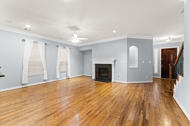 10106 Holly Chase Dr, Houston, TX 77042 - unfurnished living room with stairway, light wood-type flooring, a ceiling fan, a fireplace, and baseboards