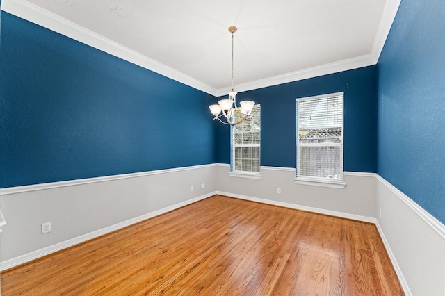 10106 Holly Chase Dr, Houston, TX 77042 - unfurnished room with wood finished floors, a chandelier, ornamental molding, and baseboards