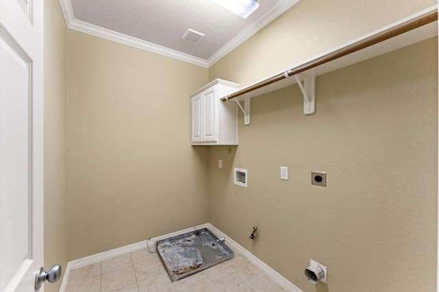 10106 Holly Chase Dr, Houston, TX 77042 - laundry area with hookup for a washing machine, hookup for a gas dryer, crown molding, hookup for an electric dryer, and cabinet space