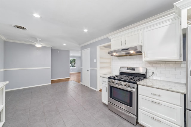 8022 Ridgeview Dr, Houston, TX 77055 - kitchen with stainless steel range with gas cooktop, under cabinet range hood, ornamental molding, white cabinetry, and ceiling fan