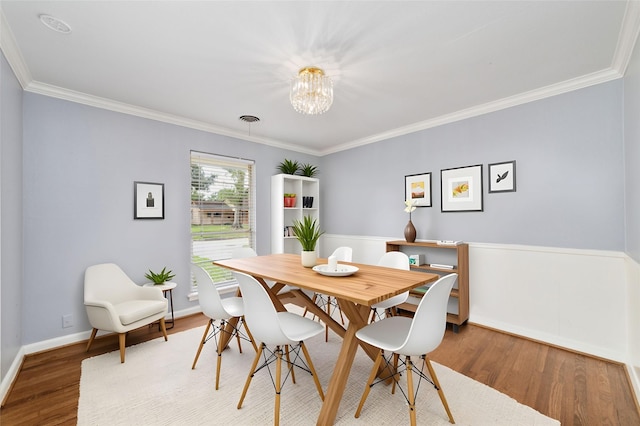 8022 Ridgeview Dr, Houston, TX 77055 - dining room featuring a chandelier, crown molding, wood finished floors, and baseboards