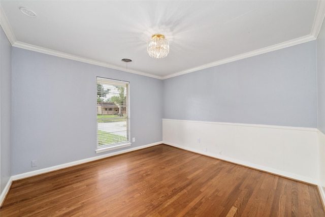 8022 Ridgeview Dr, Houston, TX 77055 - spare room featuring wood finished floors, a chandelier, crown molding, and baseboards