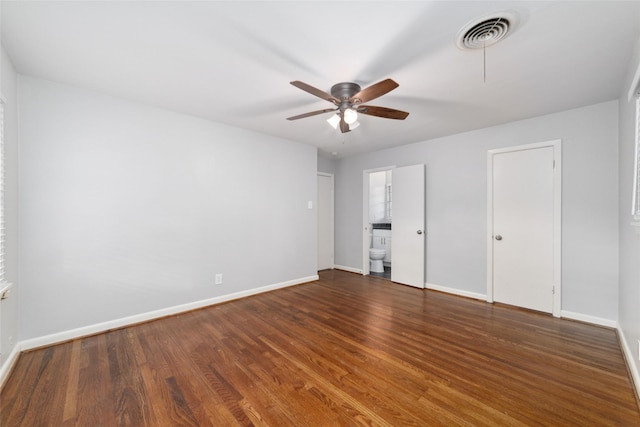 8022 Ridgeview Dr, Houston, TX 77055 - unfurnished bedroom featuring baseboards, wood finished floors, connected bathroom, and ceiling fan