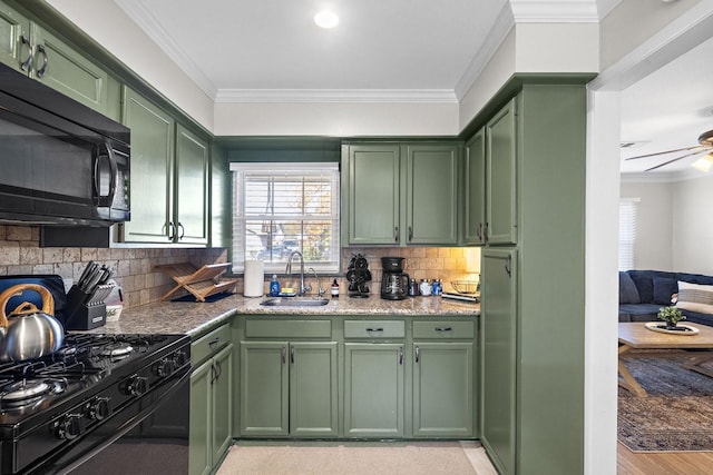 3206 Carter St, Pasadena, TX 77503 - kitchen featuring green cabinetry, black appliances, a sink, crown molding, and tasteful backsplash