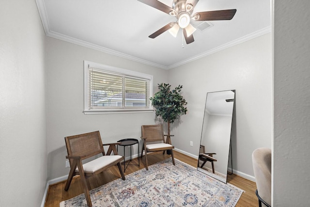 3206 Carter St, Pasadena, TX 77503 - living area featuring ceiling fan, ornamental molding, wood finished floors, and baseboards