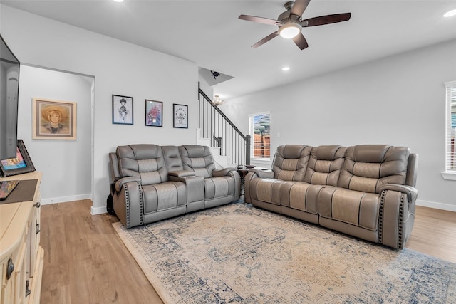 8310 Royal Breeze Dr, Cypress, TX 77433 - living room with a ceiling fan, light wood-style floors, stairway, recessed lighting, and baseboards