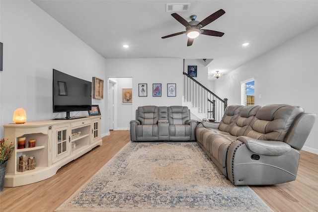 8310 Royal Breeze Dr, Cypress, TX 77433 - living room with stairway, ceiling fan, light wood-type flooring, recessed lighting, and baseboards