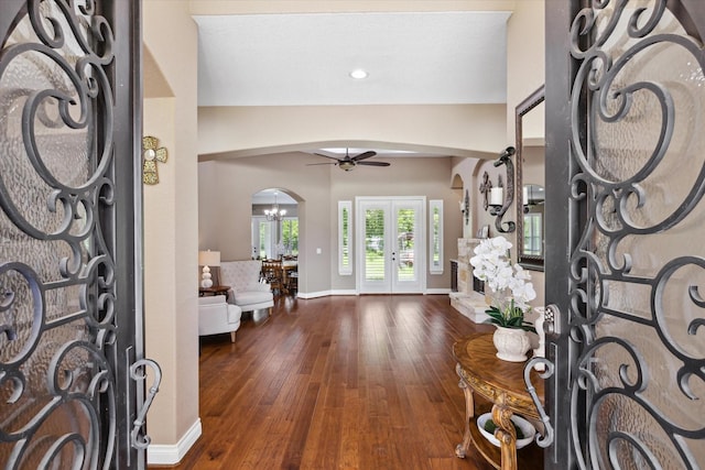 8309 Cook Rd, Manvel, TX 77578 - entryway featuring arched walkways, ceiling fan, hardwood / wood-style flooring, baseboards, and french doors