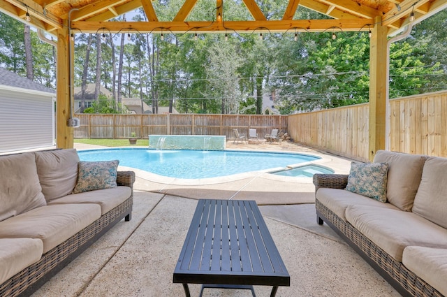 17706 August Meadows Ln, Spring, TX 77379 - view of pool featuring outdoor lounge area, a patio area, a fenced backyard, and a pool with connected hot tub