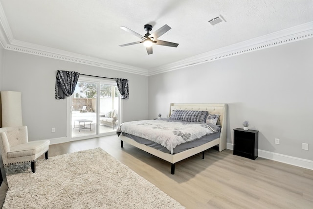 17706 August Meadows Ln, Spring, TX 77379 - bedroom featuring ornamental molding, access to outside, wood finished floors, baseboards, and ceiling fan