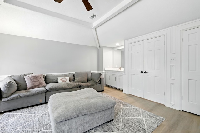 17706 August Meadows Ln, Spring, TX 77379 - living room with light wood-style flooring and a ceiling fan