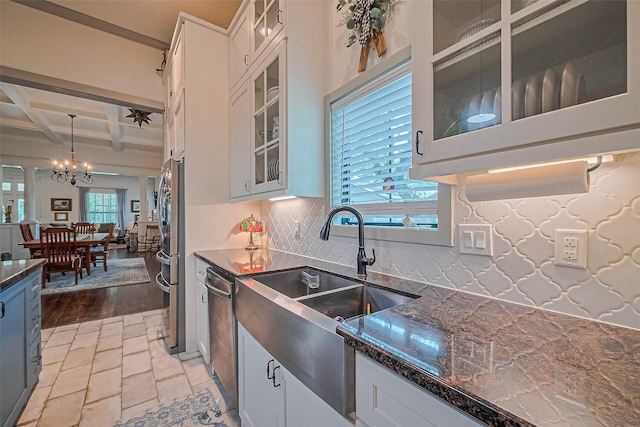 500 W Post Office St, Eagle Lake, TX 77434 - kitchen with a sink, coffered ceiling, a chandelier, decorative backsplash, and white cabinets