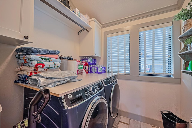 500 W Post Office St, Eagle Lake, TX 77434 - laundry area featuring washer and clothes dryer, cabinet space, and baseboards