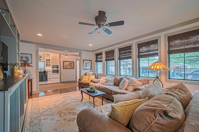 500 W Post Office St, Eagle Lake, TX 77434 - living area featuring a ceiling fan, light wood-style floors, recessed lighting, and a textured ceiling