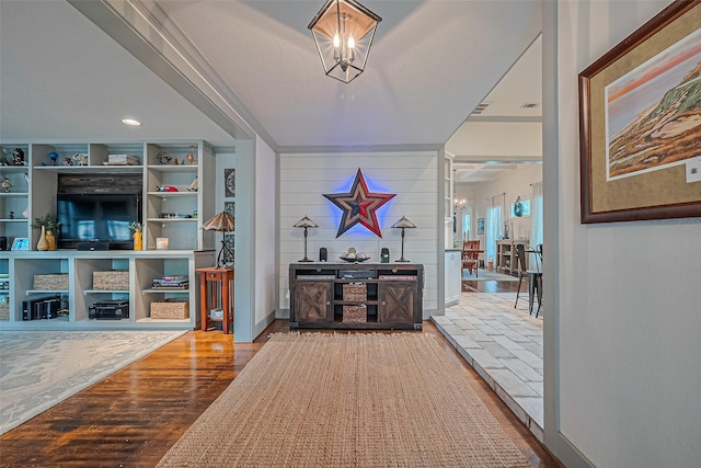 500 W Post Office St, Eagle Lake, TX 77434 - hall with a chandelier, wood finished floors, and baseboards