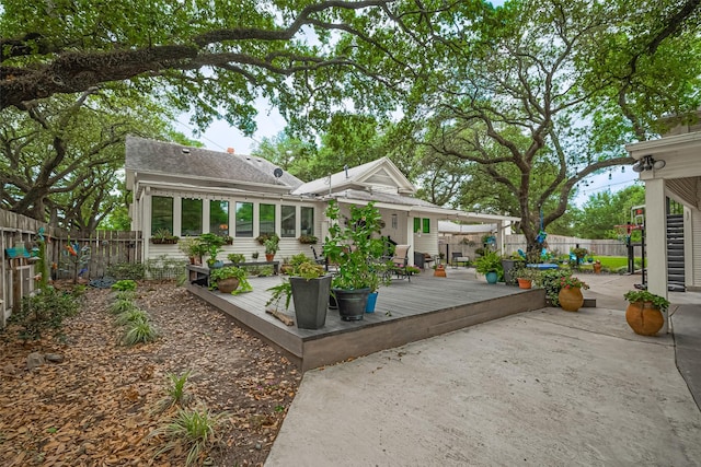 500 W Post Office St, Eagle Lake, TX 77434 - wooden deck with a fenced backyard and a patio