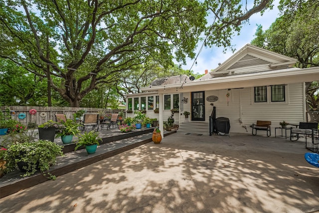 500 W Post Office St, Eagle Lake, TX 77434 - back of property featuring fence and a patio area