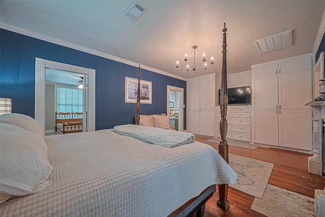 500 W Post Office St, Eagle Lake, TX 77434 - bedroom featuring wood finished floors, a chandelier, and ornamental molding