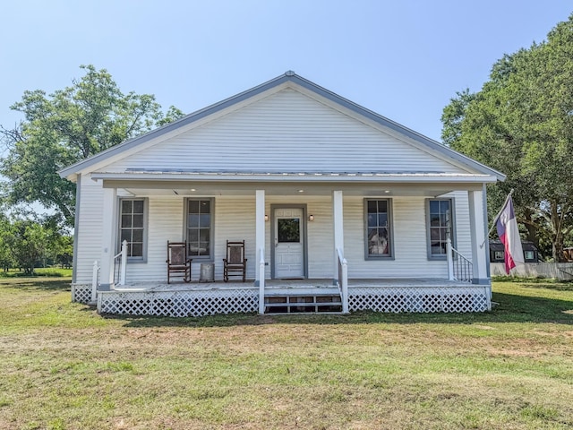 1111 Fm 109, New Ulm, TX 78950 - view of front of property featuring a front lawn and covered porch