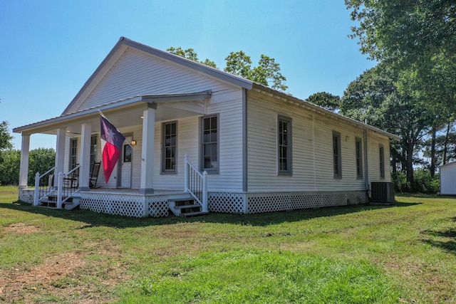 1111 Fm 109, New Ulm, TX 78950 - view of front of home featuring central AC unit, a front lawn, and a porch