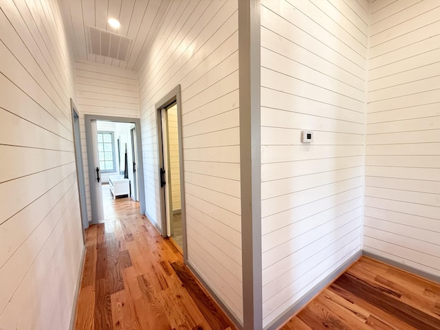 1111 Fm 109, New Ulm, TX 78950 - hall with light wood finished floors and wooden walls