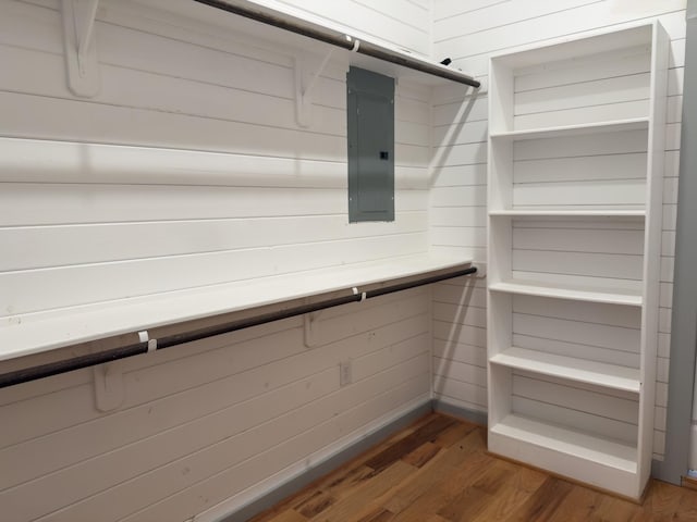 1111 Fm 109, New Ulm, TX 78950 - walk in closet featuring electric panel and wood finished floors