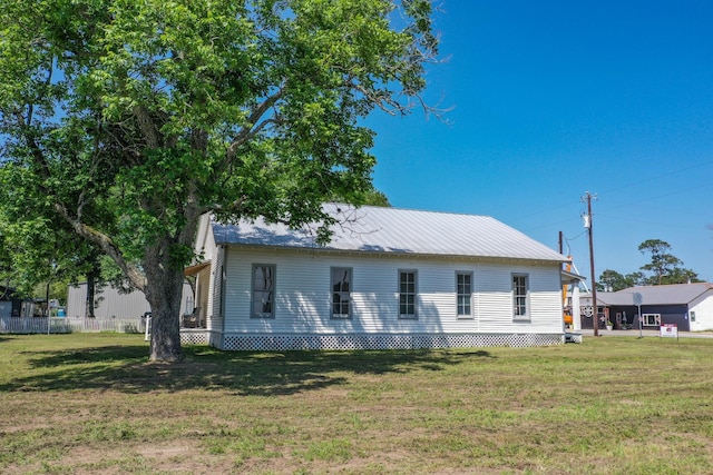 1111 Fm 109, New Ulm, TX 78950 - view of side of property featuring a lawn and metal roof