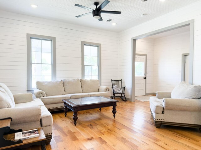 1111 Fm 109, New Ulm, TX 78950 - living area with a ceiling fan, light wood-style flooring, wooden walls, and recessed lighting
