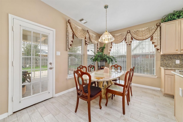 6610 Golden View Ct, Houston, TX 77083 - dining room with baseboards, plenty of natural light, and light wood-type flooring