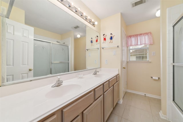 6610 Golden View Ct, Houston, TX 77083 - bathroom featuring a shower with door, baseboards, tile patterned floors, and double vanity