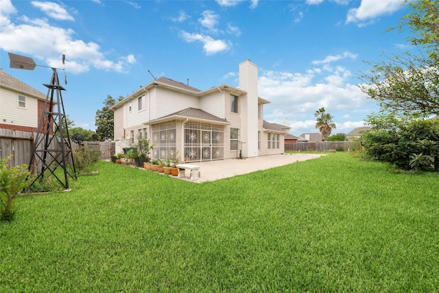 6610 Golden View Ct, Houston, TX 77083 - rear view of house with a chimney, a patio, and a sunroom