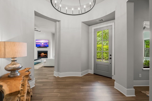 19 Pronghorn Pl, The Woodlands, TX 77389 - foyer entrance with plenty of natural light, wood finished floors, baseboards, and a high ceiling