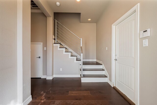 4307 Hershe St, Houston, TX 77020 - entryway with wood finished floors, stairs, baseboards, and recessed lighting