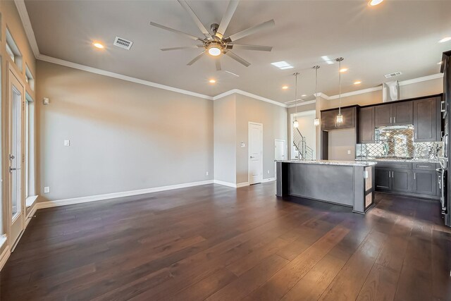 4307 Hershe St, Houston, TX 77020 - kitchen with dark wood-type flooring, ceiling fan, backsplash, dark brown cabinets, and recessed lighting