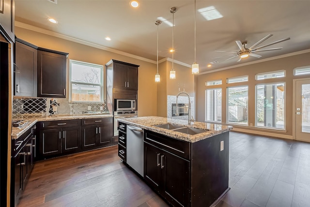 4307 Hershe St, Houston, TX 77020 - kitchen with stainless steel appliances, a sink, dark wood-style flooring, an island with sink, and ceiling fan