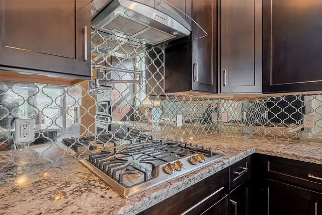 4307 Hershe St, Houston, TX 77020 - kitchen with ventilation hood, stainless steel gas stovetop, tasteful backsplash, and dark brown cabinets